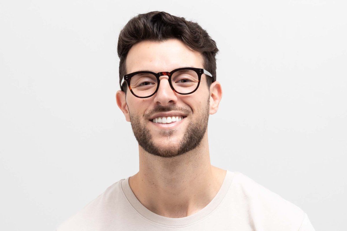Man wearing round tortoiseshell glasses