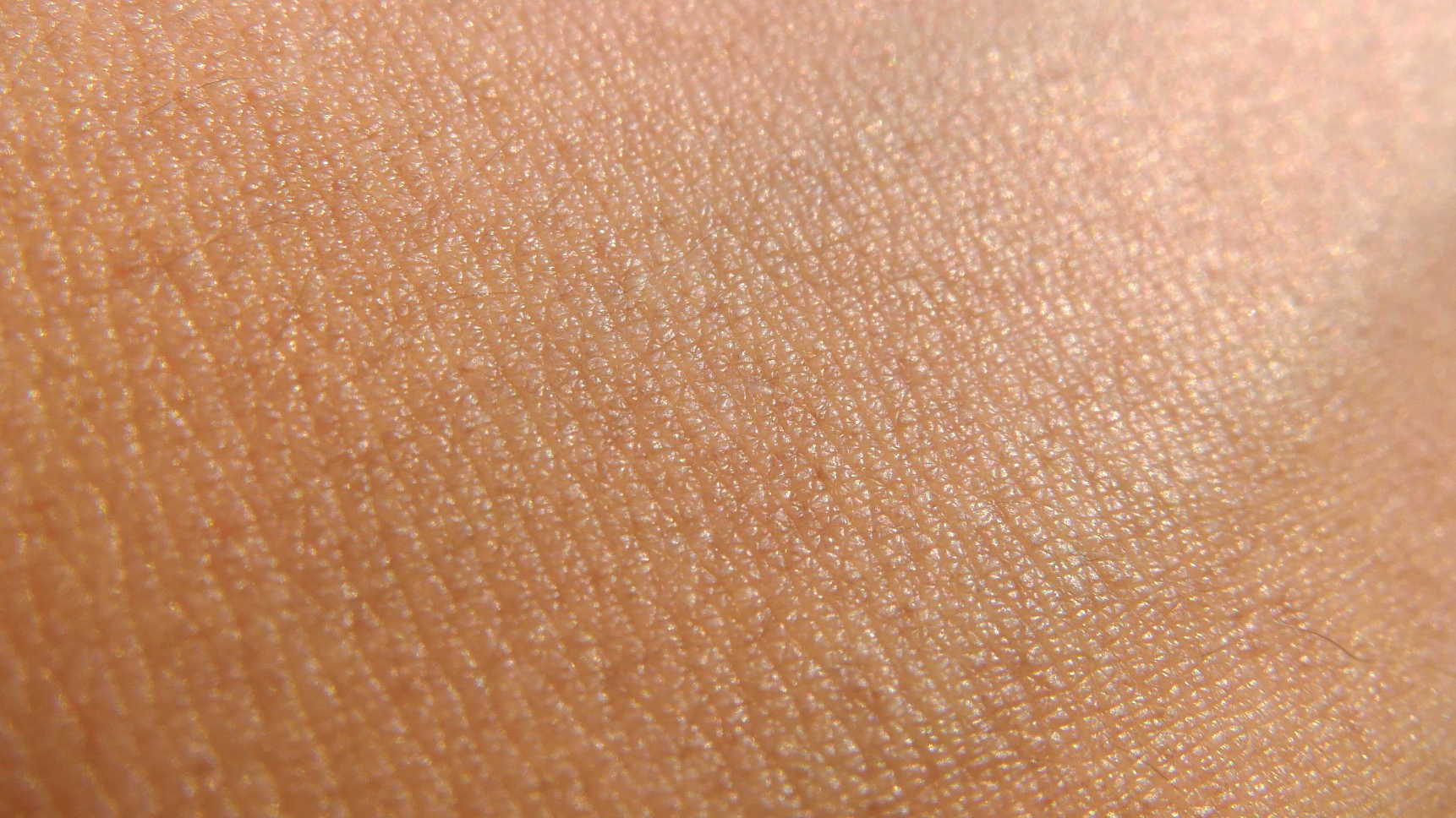 A close-up photograph of clear, young skin with no visible blemishes or acne.