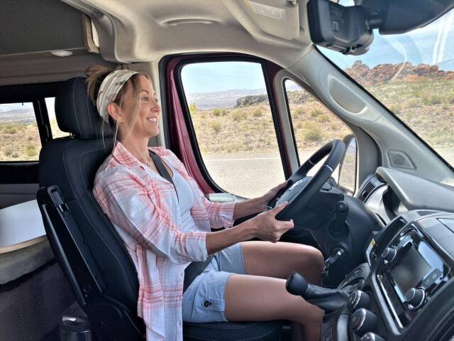 Stefany driving their RV through the desert.