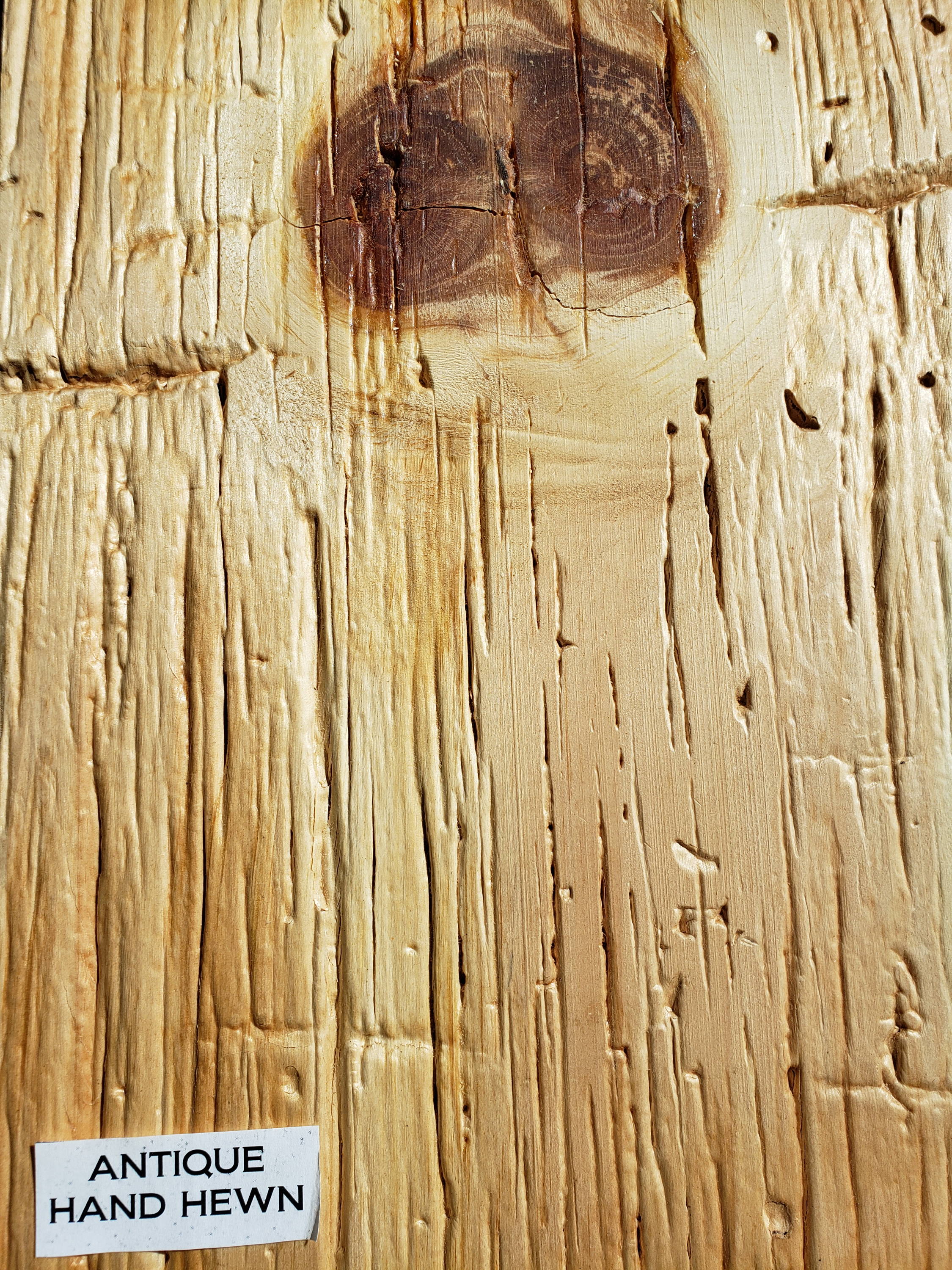 New wood surfaced too look like an antique hand hewn board or beam