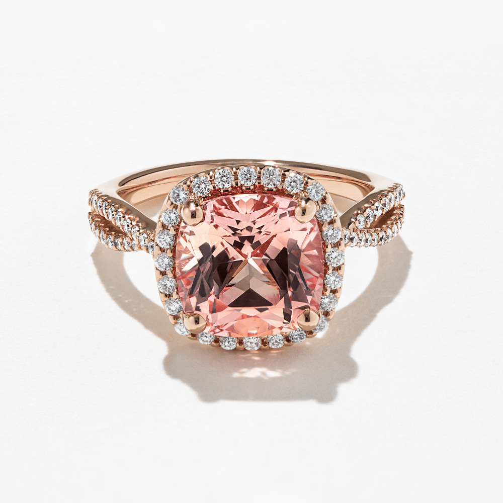 champagne pink sapphire engagement ring in diamond halo with accented rose gold band
