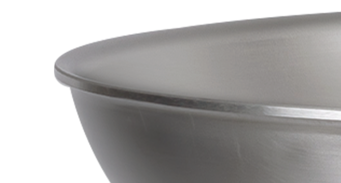 The Misen Carbon Steel Pan lets in the perfect airflow, yet is still tall enough to prevent grease from splattering.