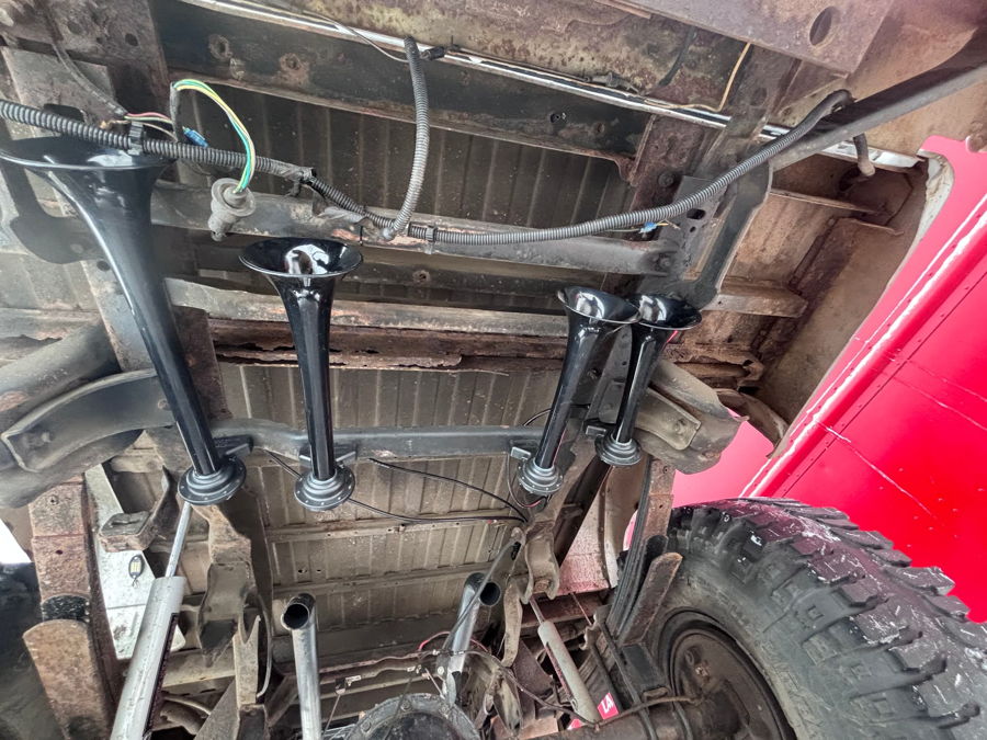 Wide shot of finished Conductor's Special train horn kit install on Junior's 1984 Chevy Silverado K10 HornBlasters gallery photo 3