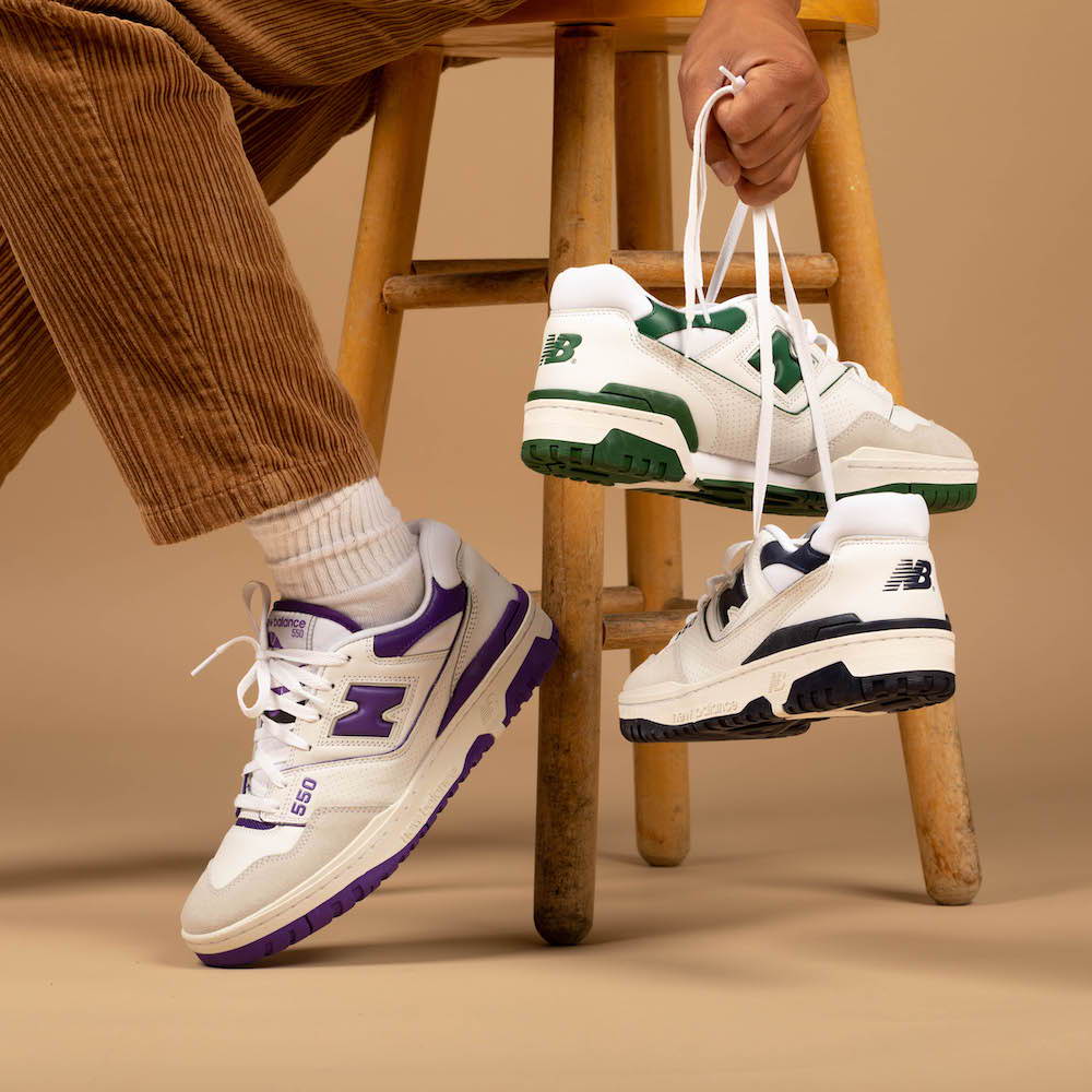 male model sitting on chair in new balance