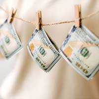 US Currency hanging on a laundry line