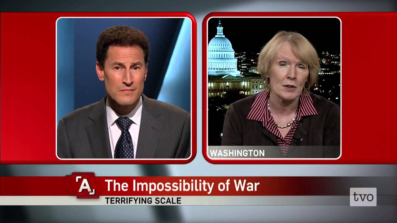 Two news presenters discussing 