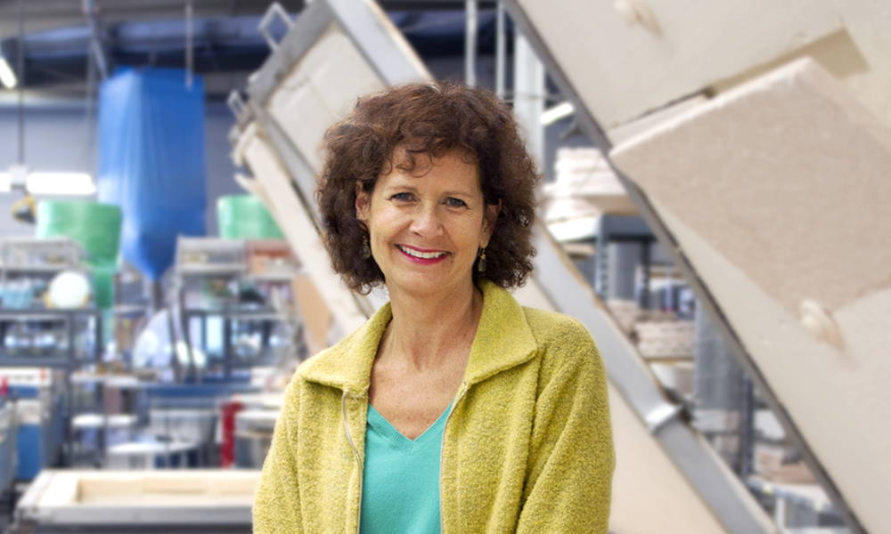 Annie Morhauser, founder of Annieglass, in her studio with her kilns