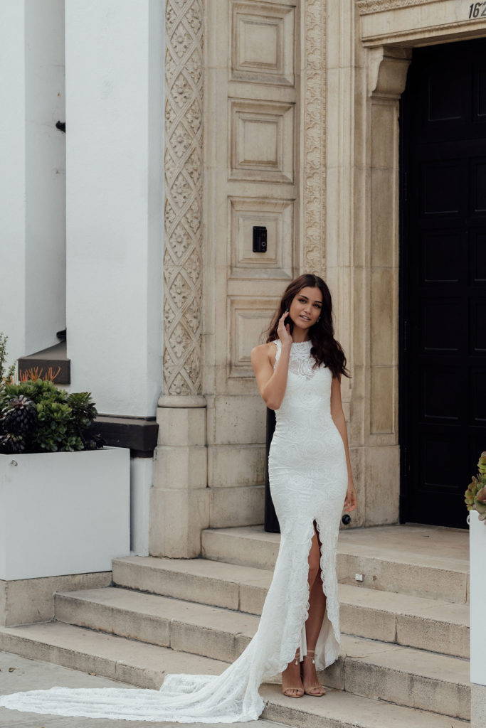 Bride wearing the Grace Loves Lace Alexandra gown in ivory wearing dosa heels