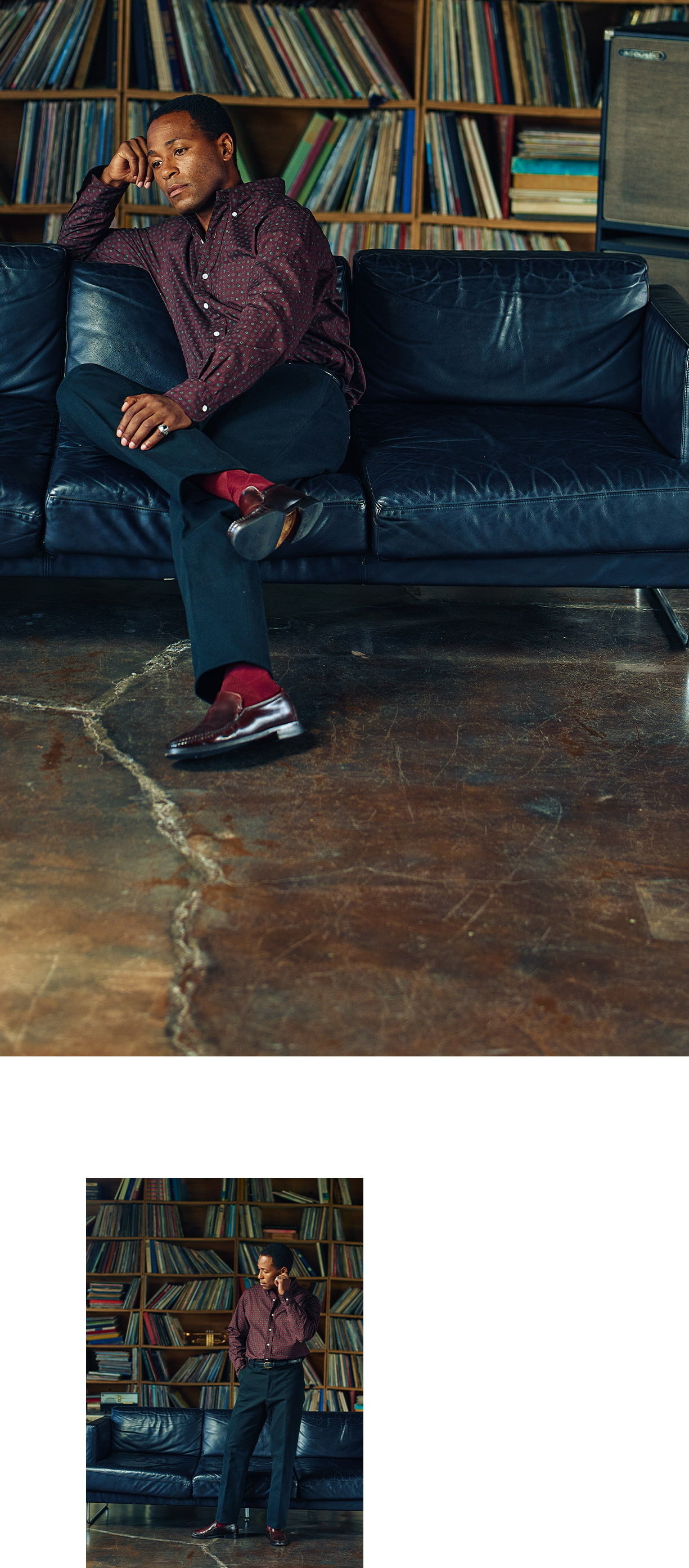 Person sitting on a couch with bookshelves in the background.