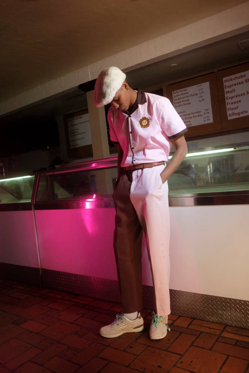 male model in ice cream shop wearing nice cream shoes