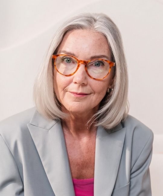 old lady looking youthful wearing Hope Orange tortoise glasses