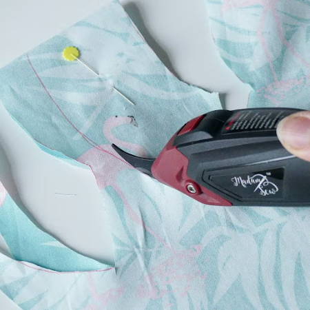 Cutting pastel fabric with electric fabric scissors
