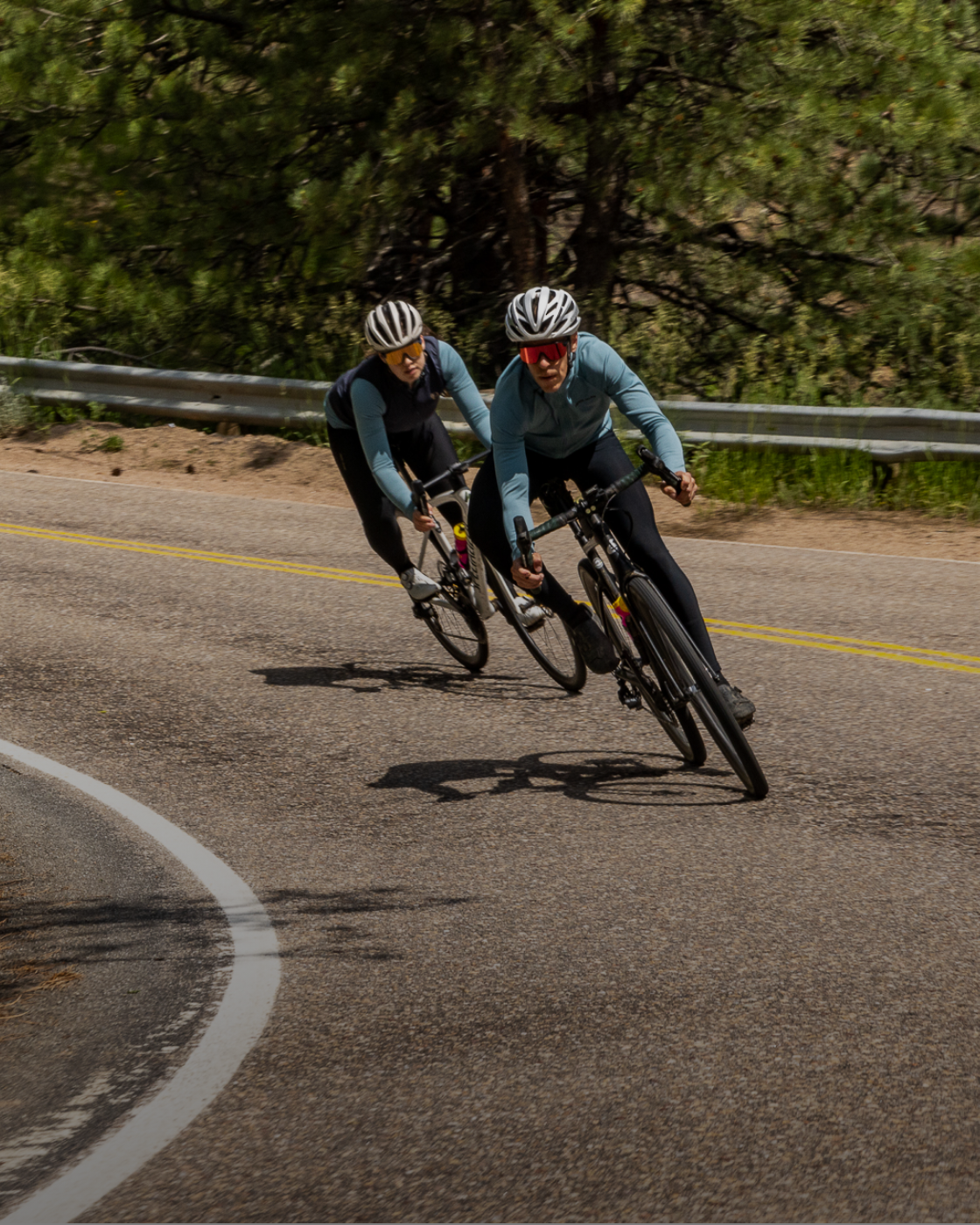 Male and female road cyclist riding in PEARL iZUMi Attack Long Sleeve Jerseys.