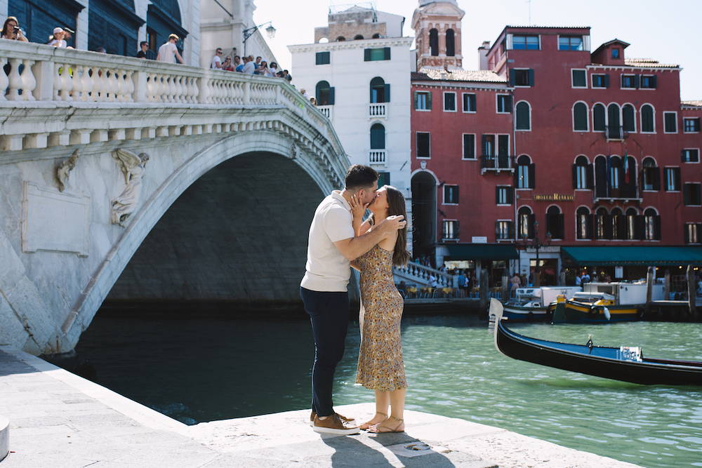 engagement proposal under a bridge in venice, italy