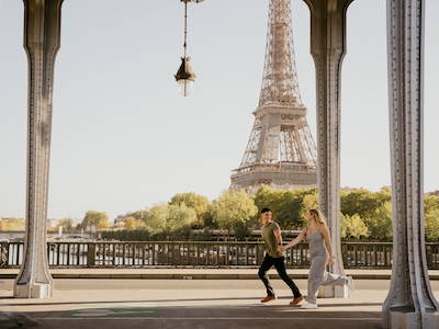 engaged couple in front of eiffel tower
