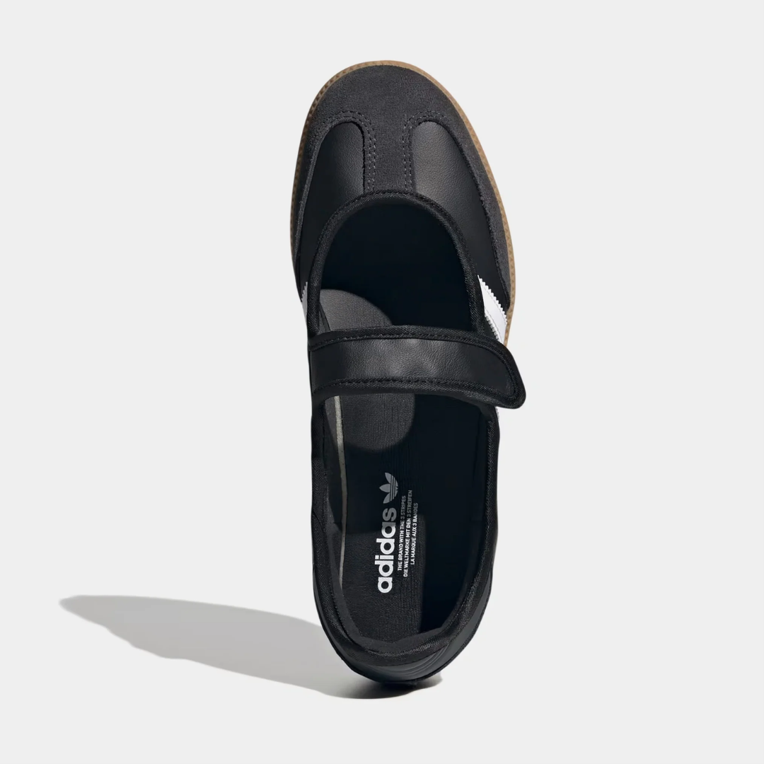 Black athletic shoe with white stripes and a velcro strap.