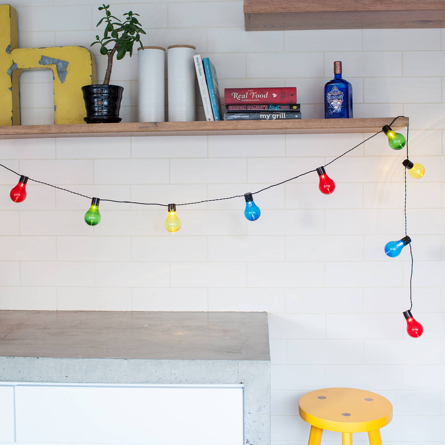 Multi coloured festoon lights in a kitchen setting