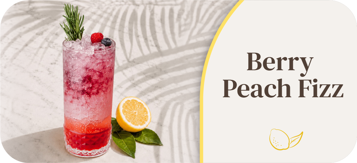 Berry Peach Fizz cocktail with berries and lemon on a decorative background.