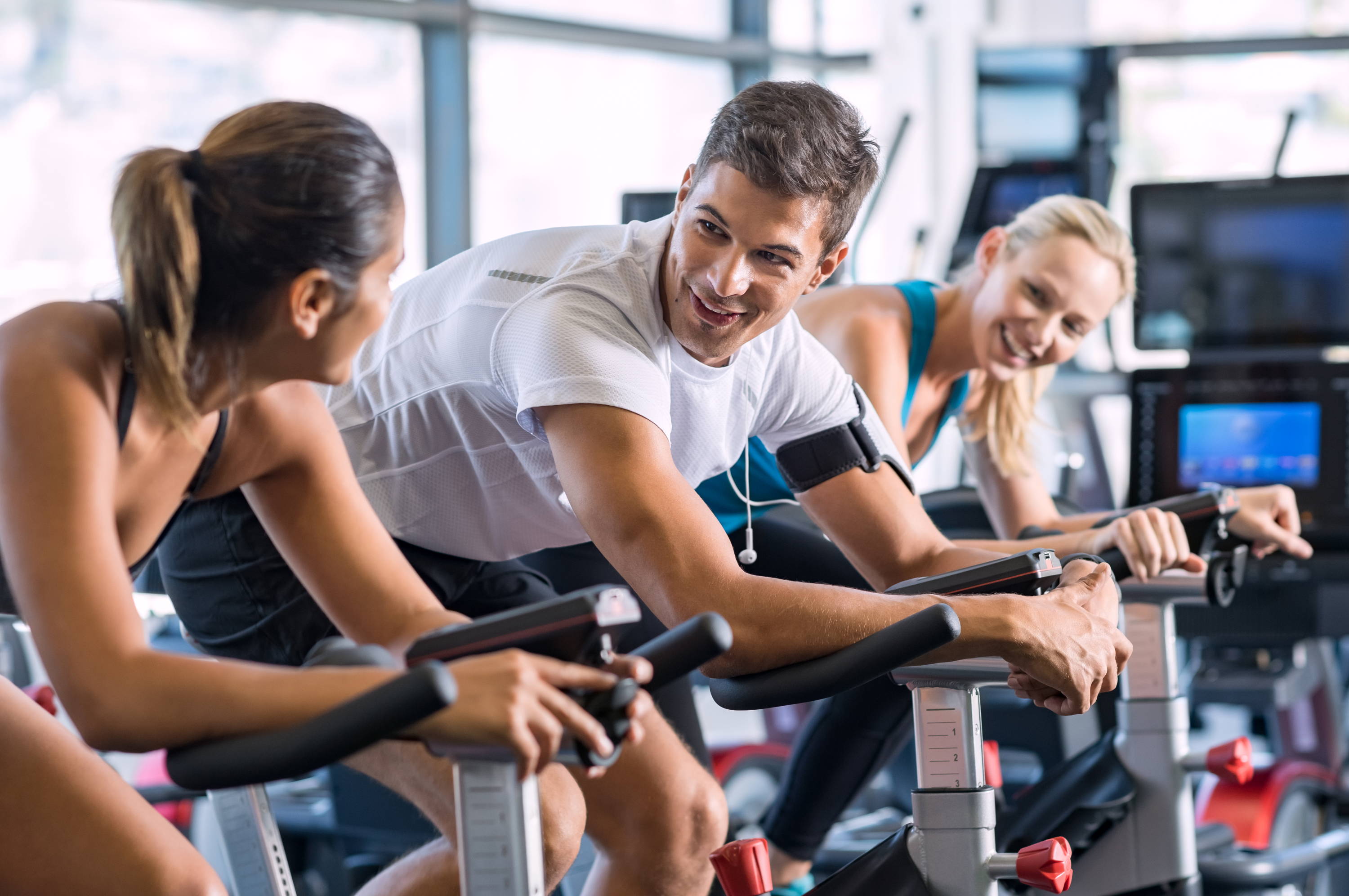 A group of people training on spin cycles.