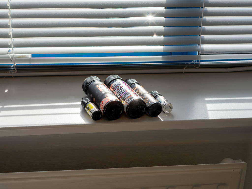 A photo showing e-liquid bottles sitting in the sun above a radiator.