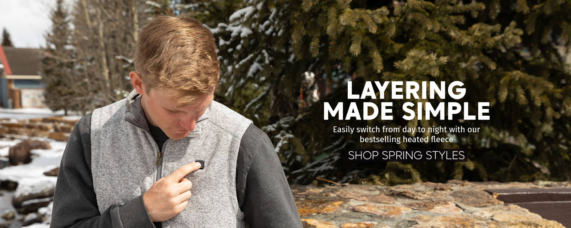 man pressing button on venture heat heated vest. layering made simple