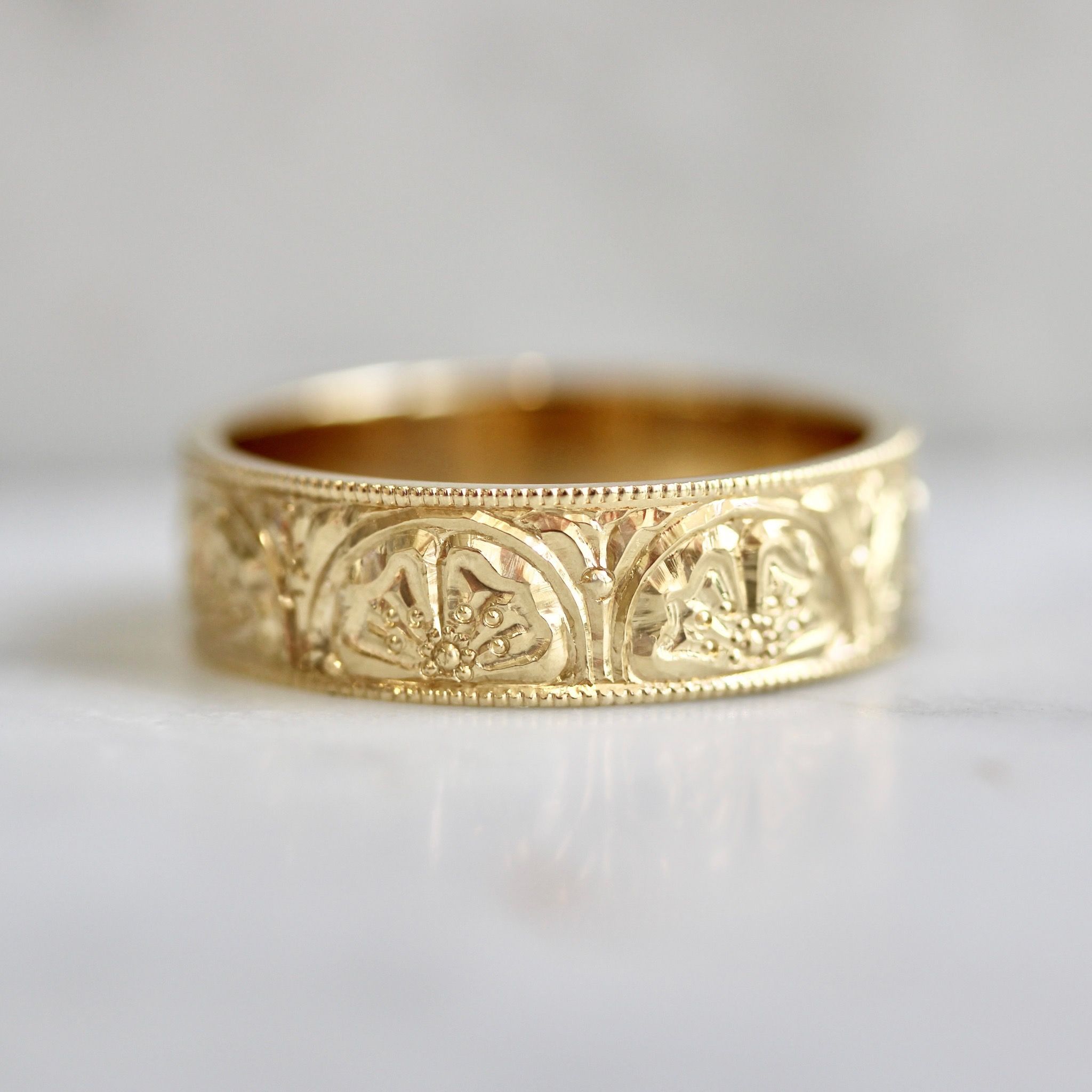 Ornate hand-engraved wide wedding band