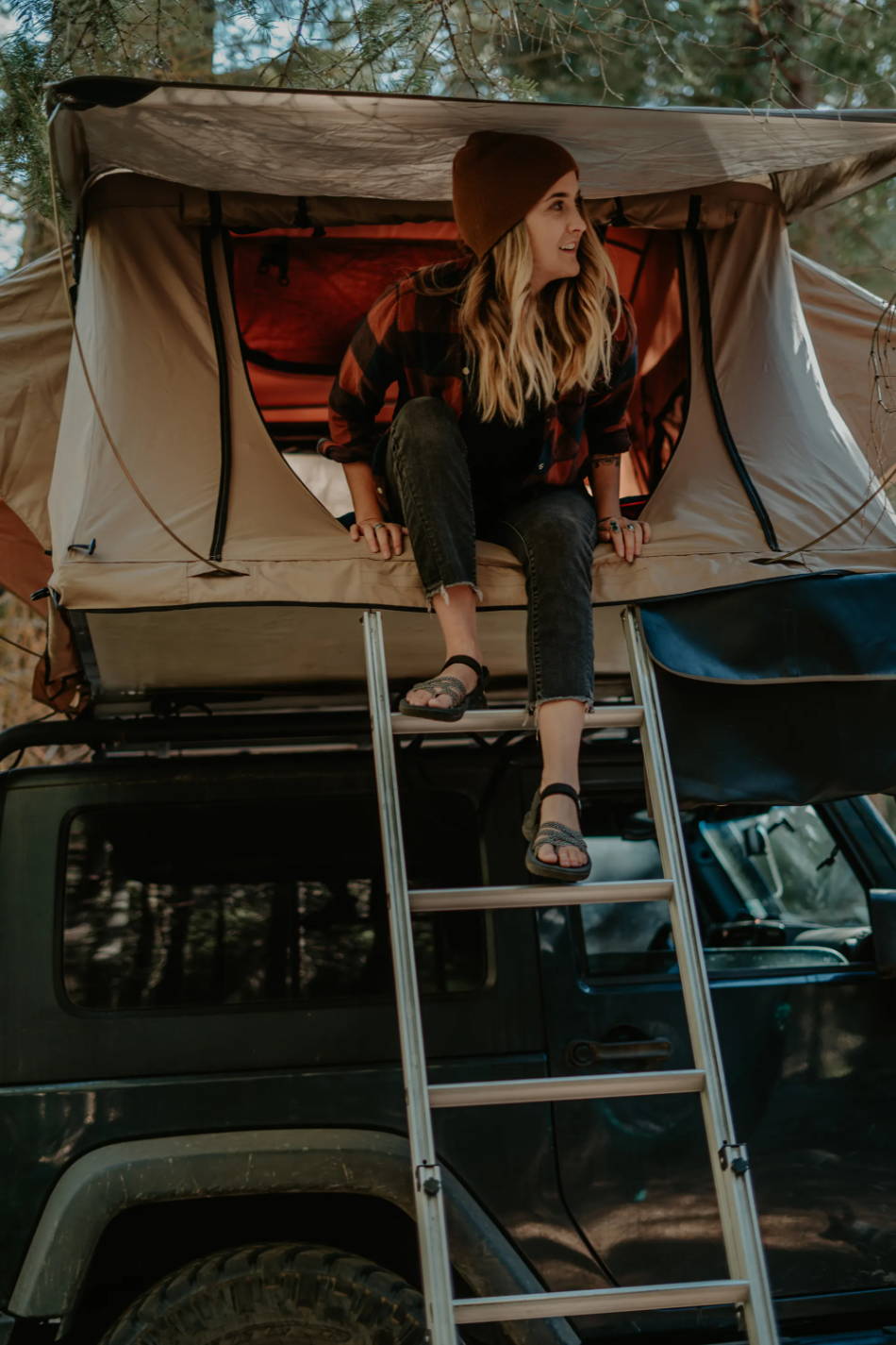 woman wearing outdoor sandals while camping in the forest