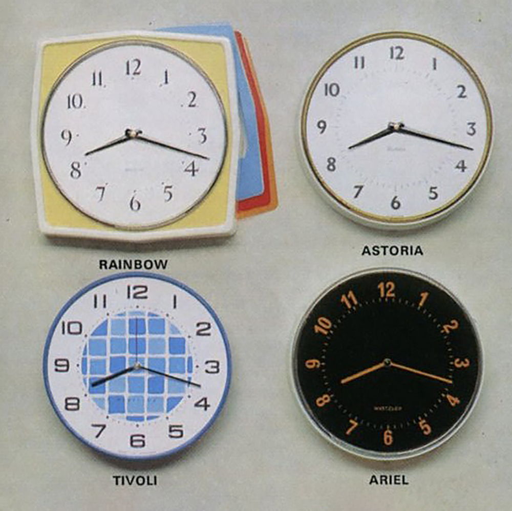 Four different wall clocks in various styles and colors.