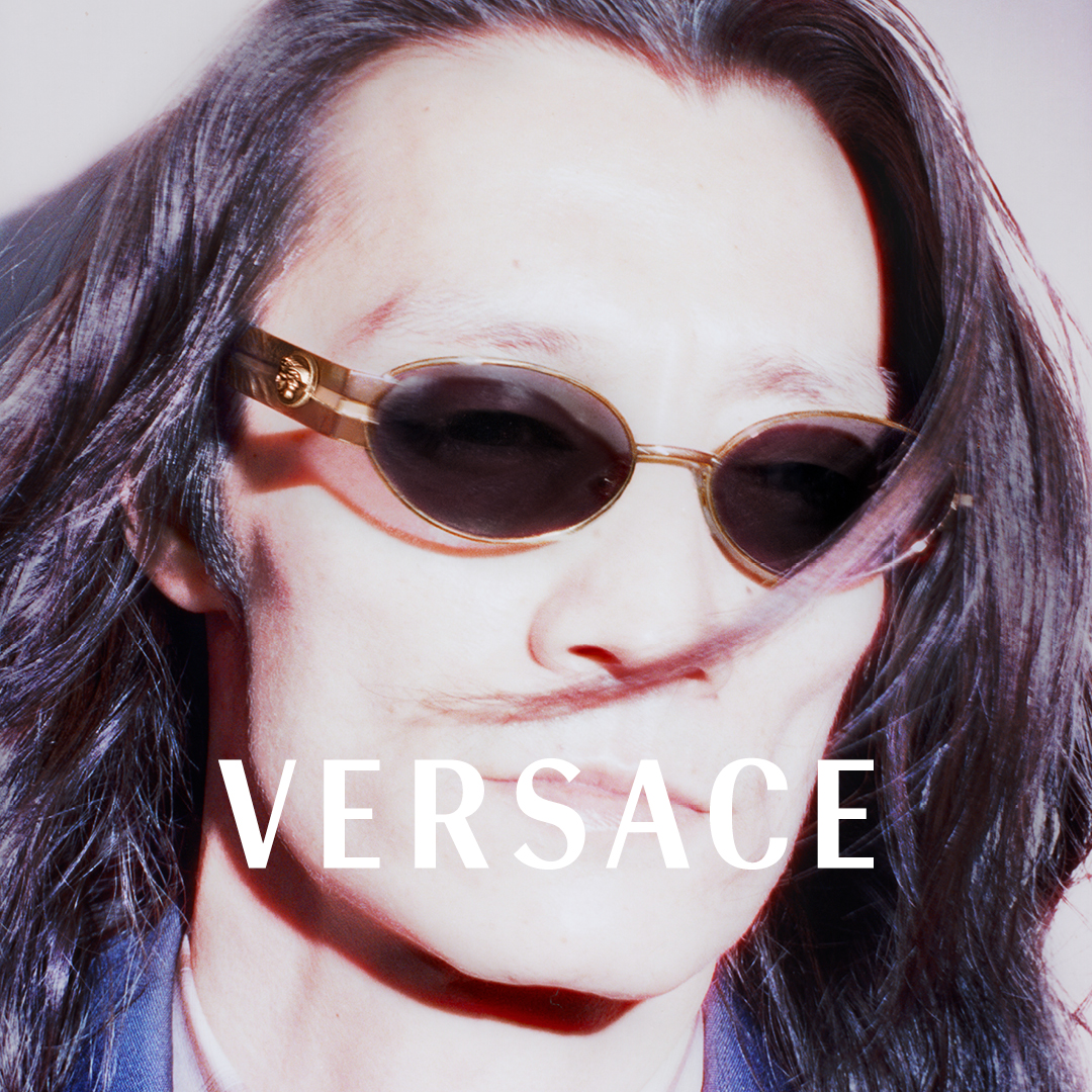 Person wearing sunglasses with the word 