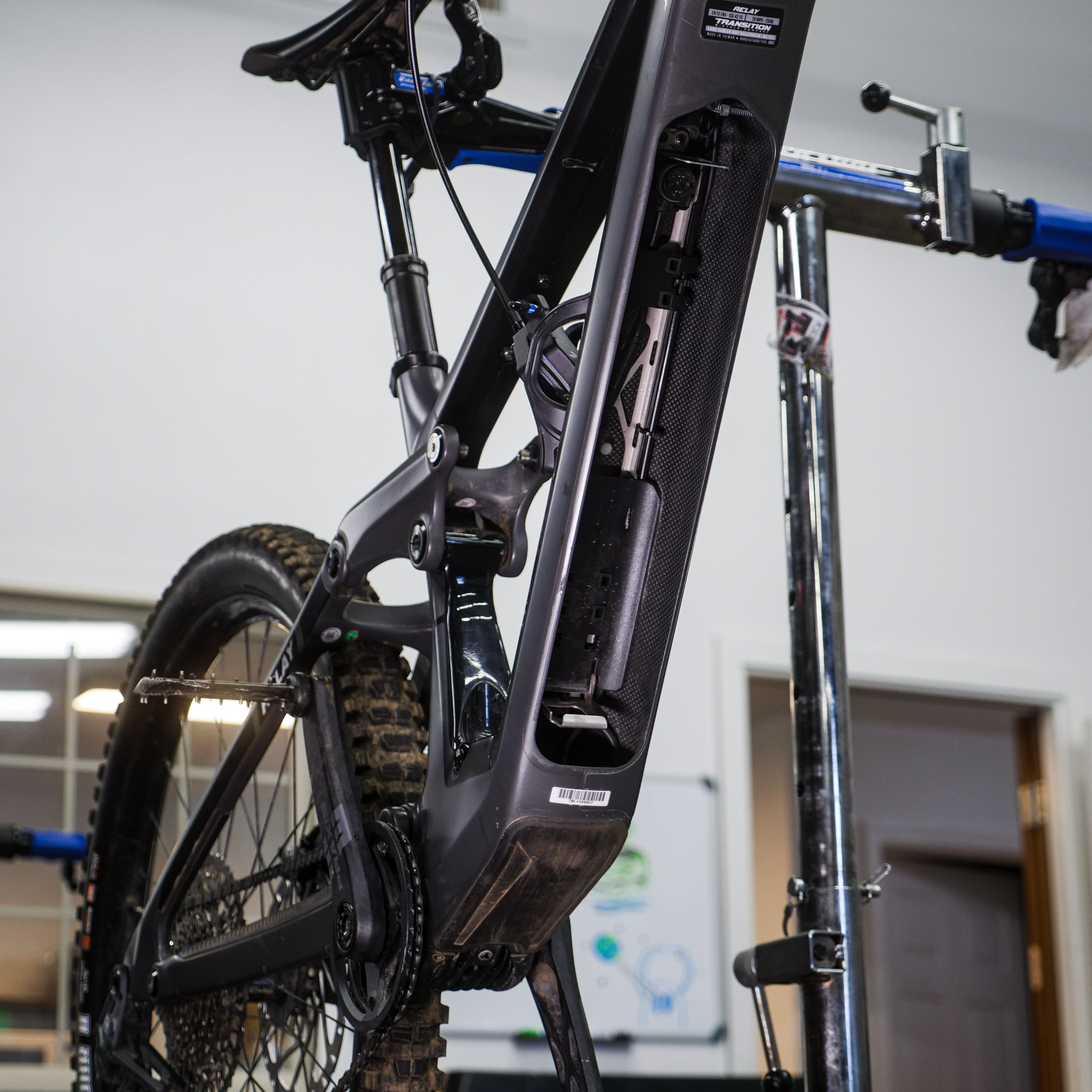 Close-up of a bicycle's frame in a repair shop.