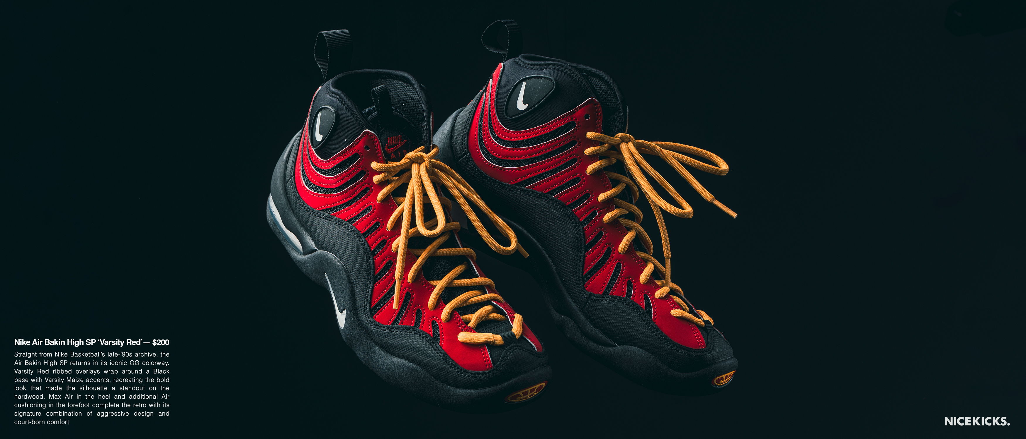 Red and black sneakers with yellow laces on a dark background.