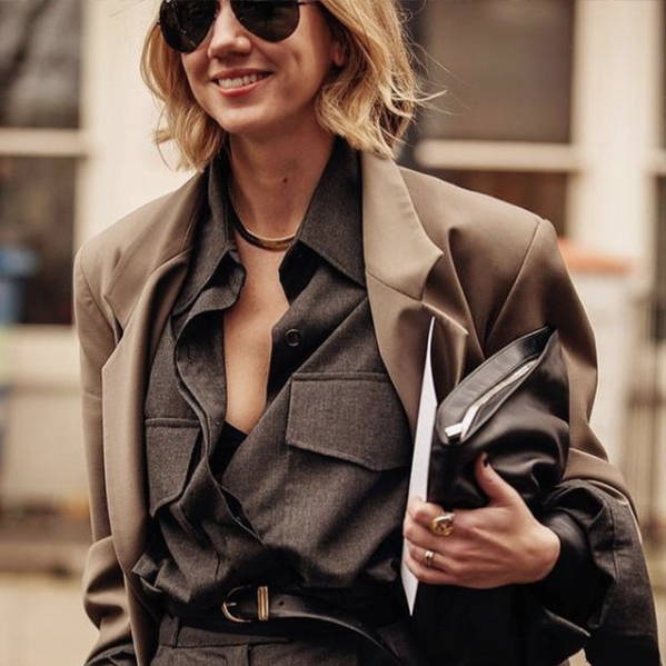 Lisa Aiken wearing a brown coat and sunglasse