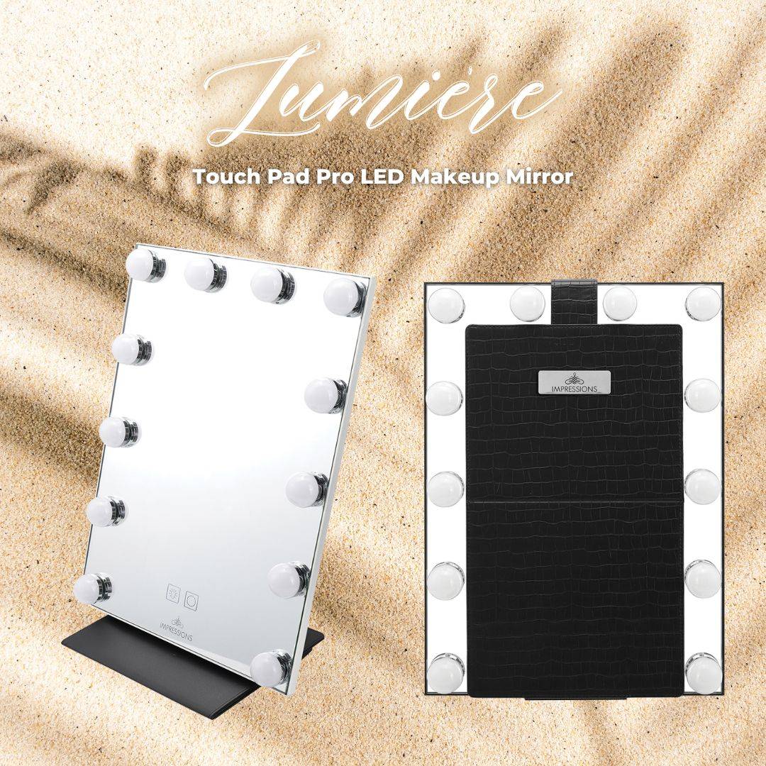 Display of lumiere touch pad pro LED makeup Mirror with sand background. 