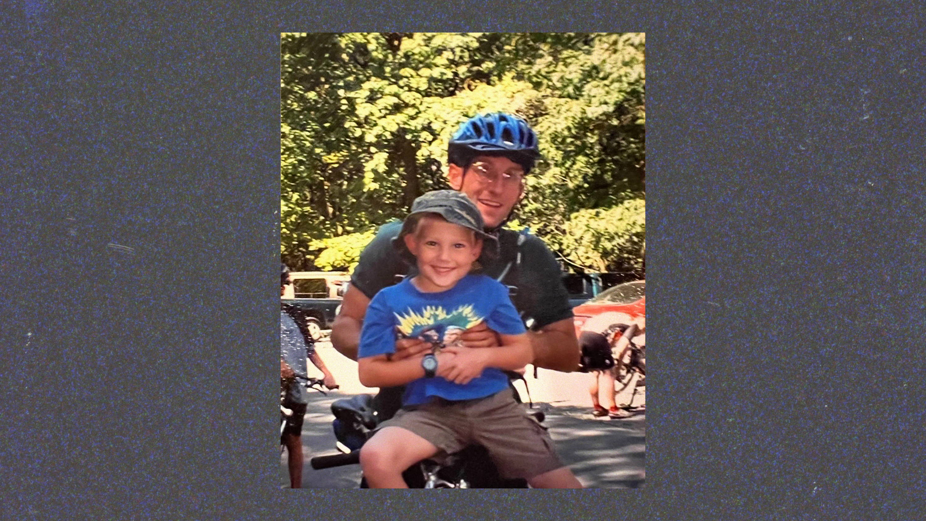 dad and son on a bike