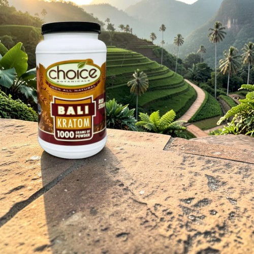 Container of Bali Kratom in a lush, green landscape.