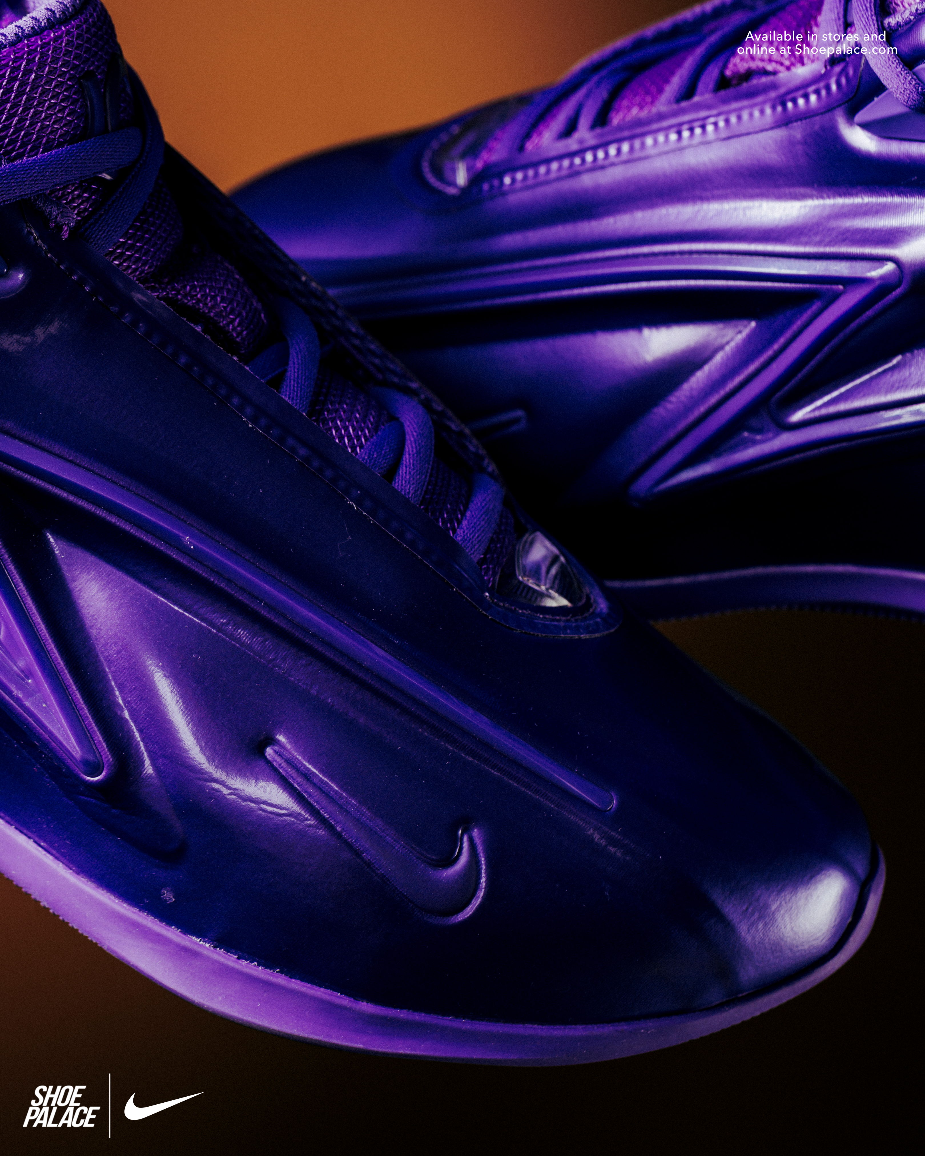 Close-up of purple Nike sneakers on a gradient background.