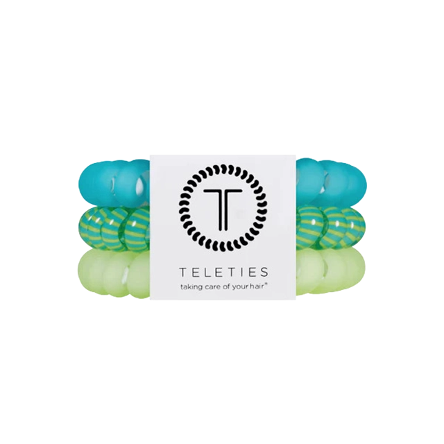 Colorful hair ties displayed with a branded tag.