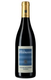A bottle of red wine with a blue and gold label.