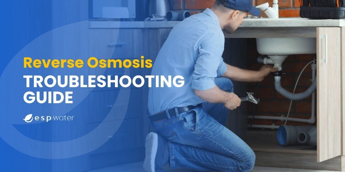 Person troubleshooting under a sink with a wrench, Reverse Osmosis guide visible.