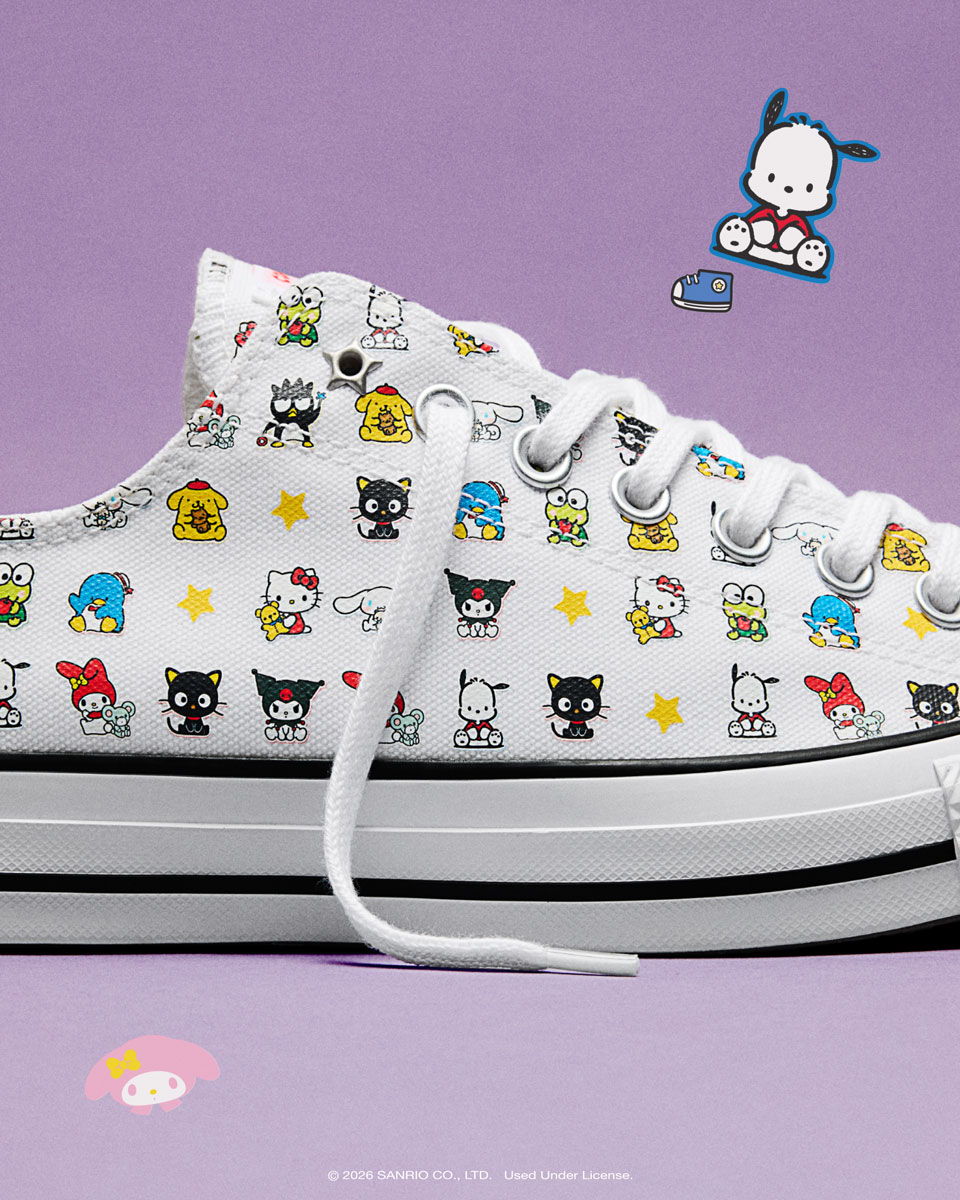 White sneakers with colorful cartoon character patterns on a purple background.