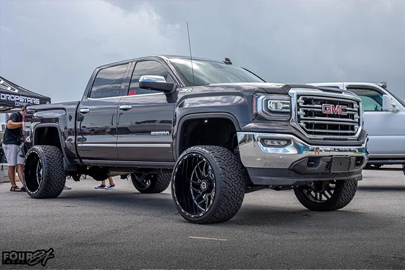 Wide shot of finished Conductor's Special Spare Tire Delete kit install on Austin's 2016 GMC Sierra 1500 HornBlasters gallery photo 4