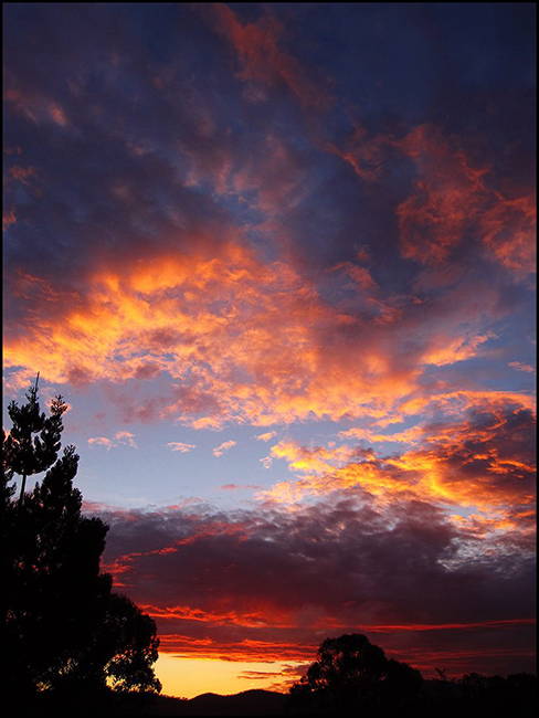 Sunset highlighting clouds in orange at the Nature's Wonderland Toogoolawah property.