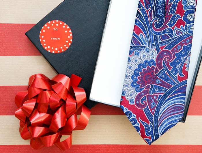 Blue and red paisley tie in a gift box for a Christmas gift