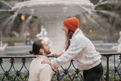 couple getting engaged in front of a fountain, forsyth park, ga