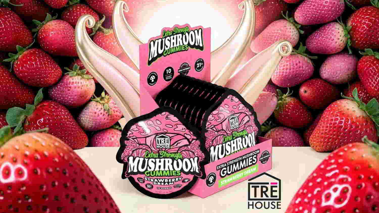 Packaging of mushroom product surrounded by strawberries.