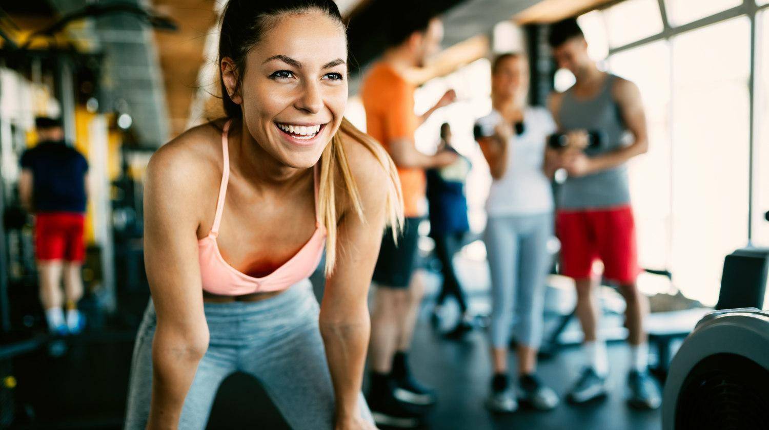 Featured | Close up image of attractive fit woman in gym | How Exercise Improves Cognitive Function and Overall Brain Health