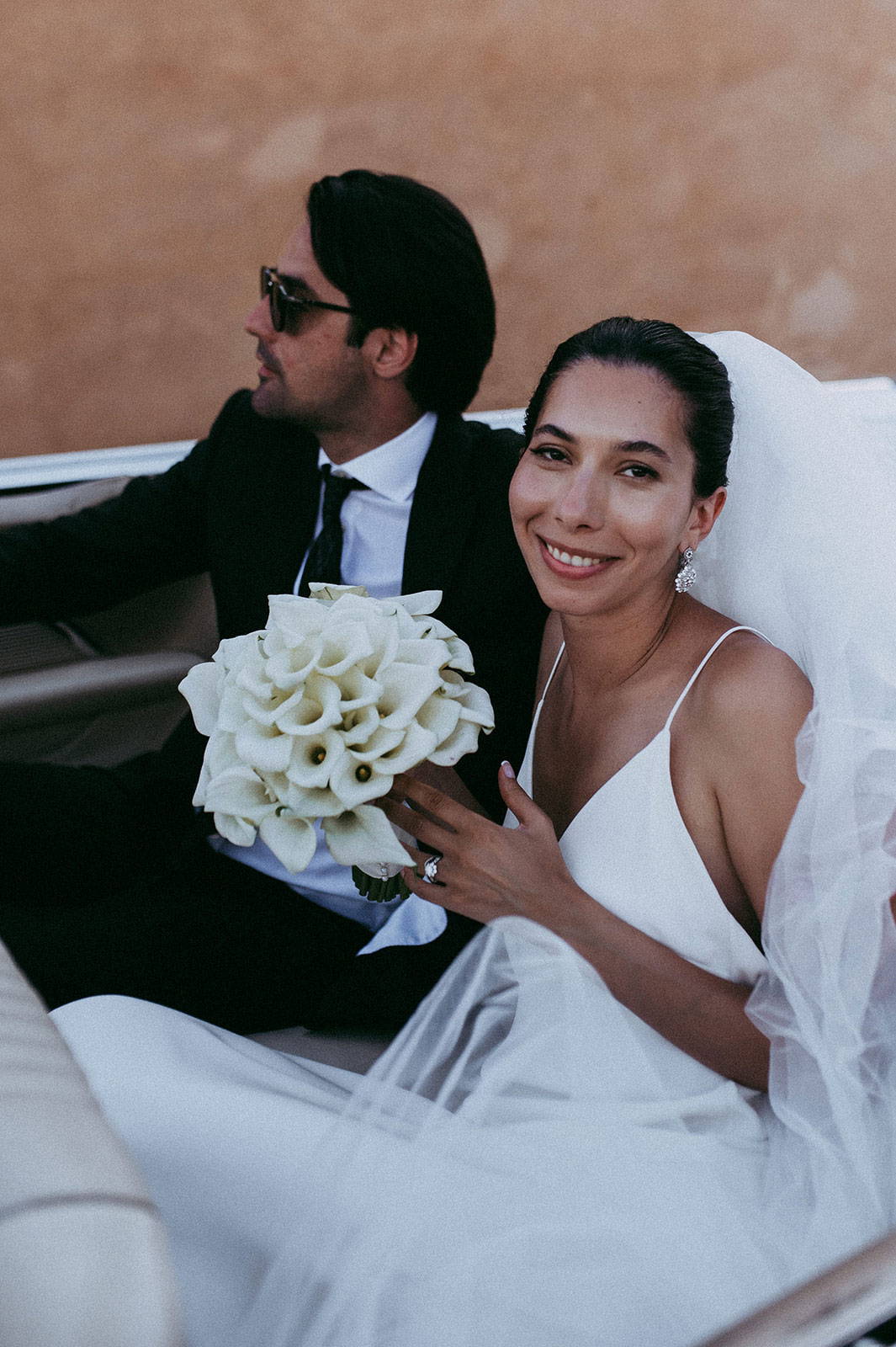 Bride and groom in car