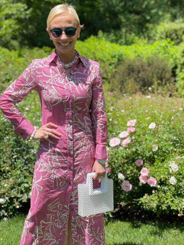 Lisa Frohlich wearing pink cotton shirt dress in the Hamptons by Ala von Auersperg