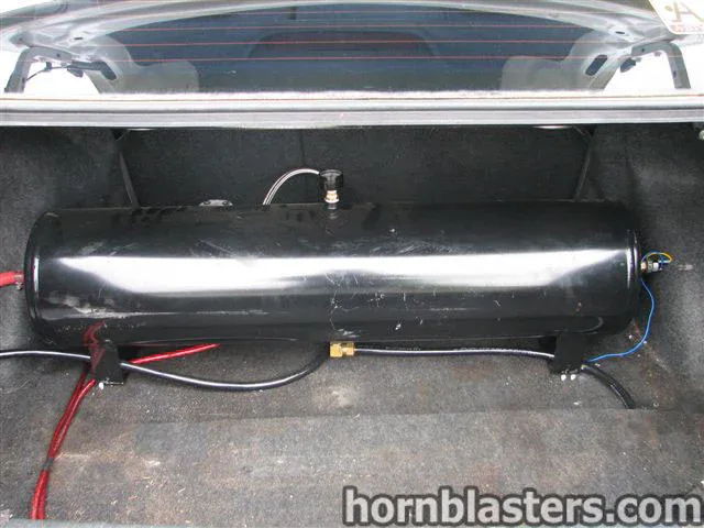 Black cylindrical air tank mounted horizontal trunk floor 2001 Toyota Corolla K5LA train horn gallery photo 12