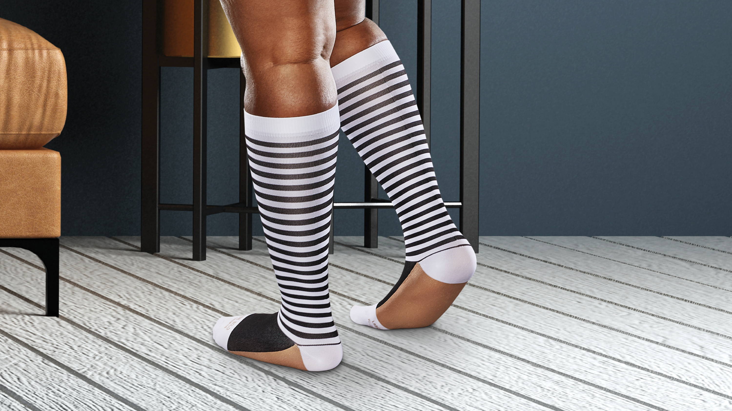 Woman standing comfortably in Ease by Therafirm patterned compression socks